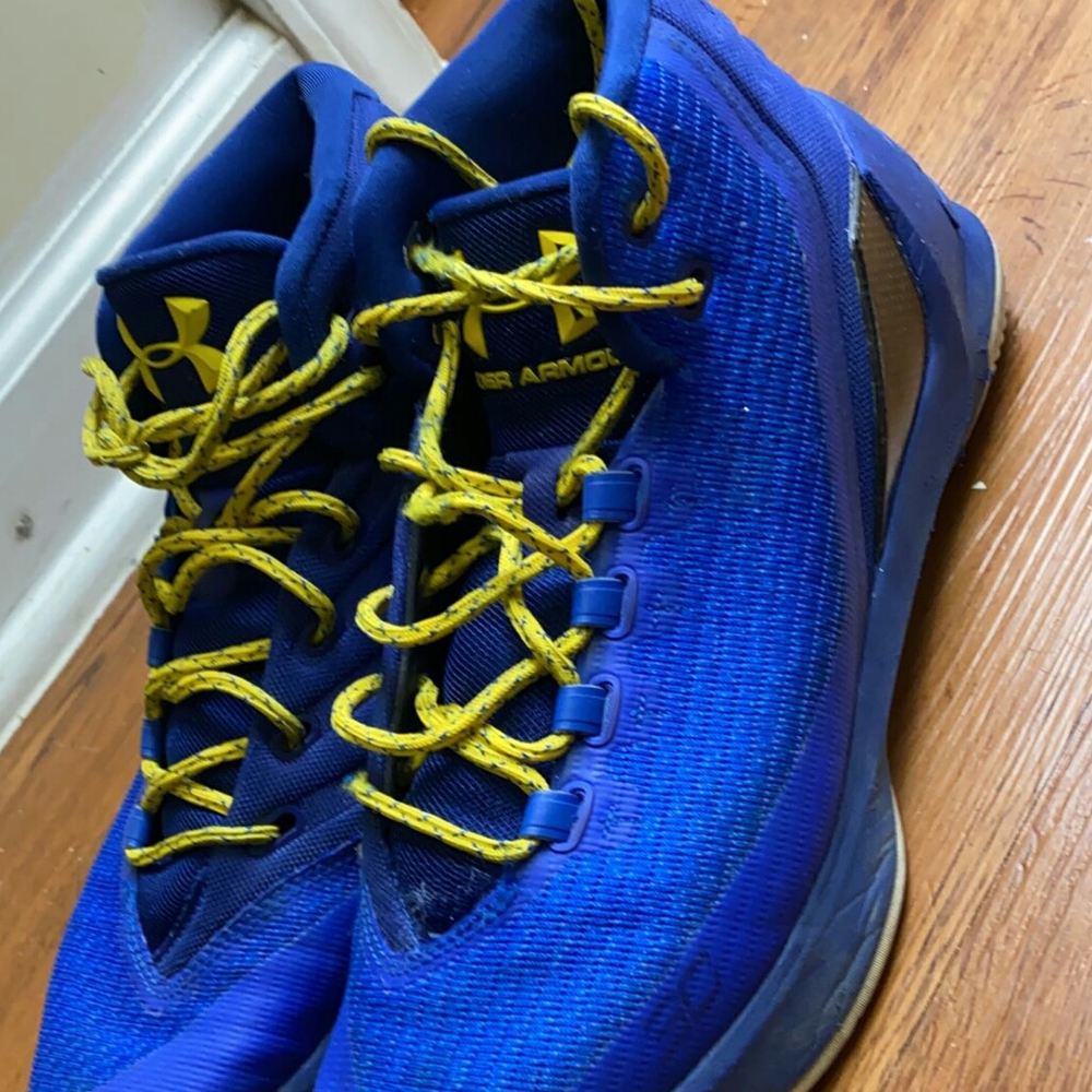 Blue and yellow under armour shoes
